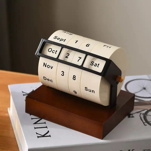 Vintage Rotating Perpetual Desk Calendar on the book