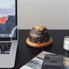 Walnut Planet Perpetual Desk Calendar on the desk