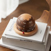 Walnut Planet Perpetual Desk Calendar on the book